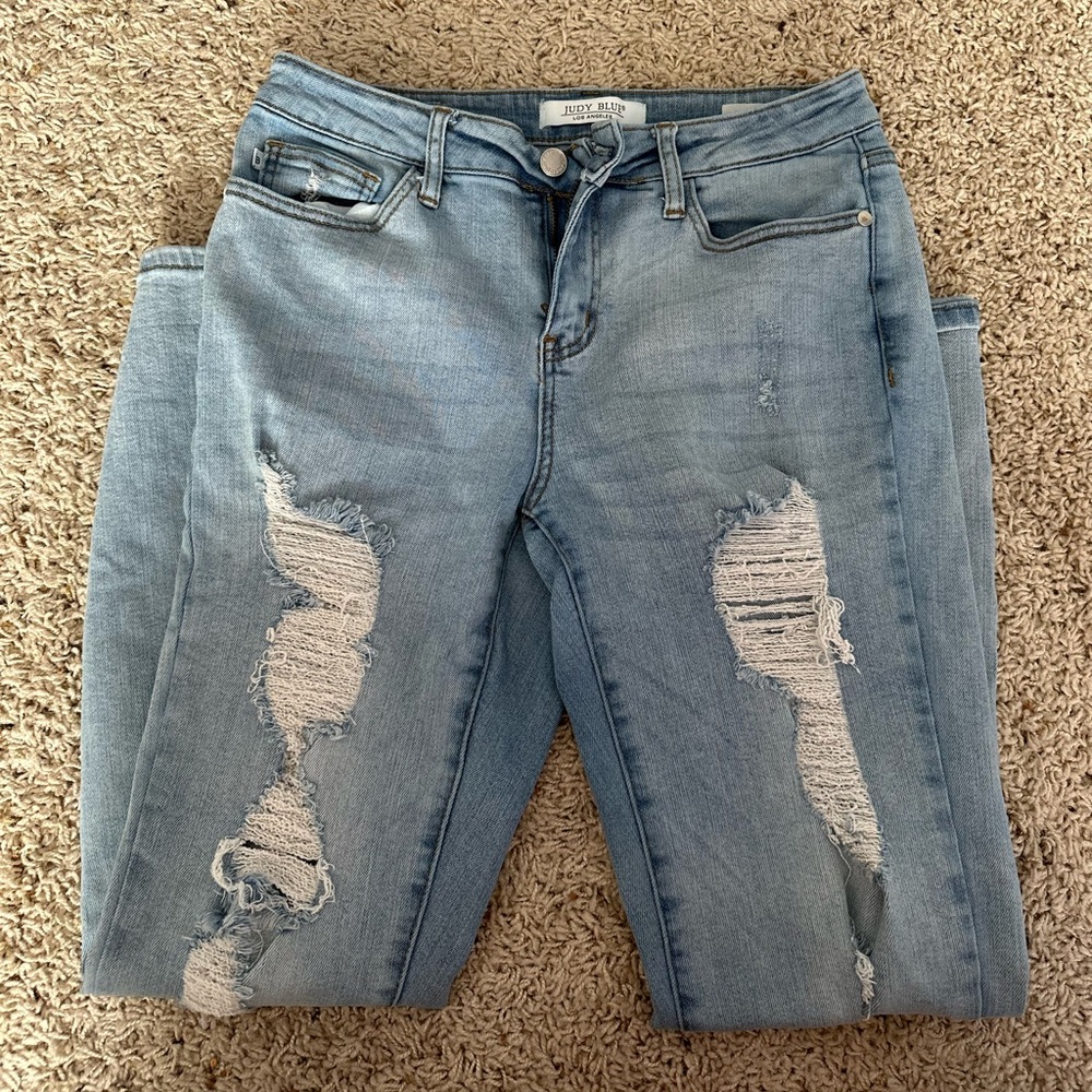 Distressed light denim skinny jeans